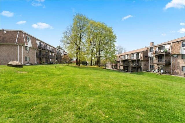 752 Quaker Ln Unit B108, Warwick, RI 02818 - surrounding community with a lawn and a residential view