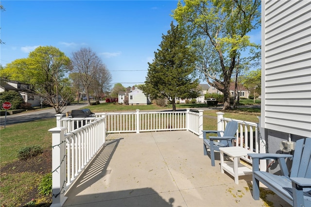 view of patio with covered porch and a residential view
