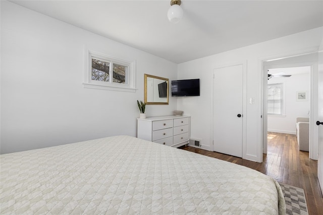bedroom featuring dark wood-type flooring