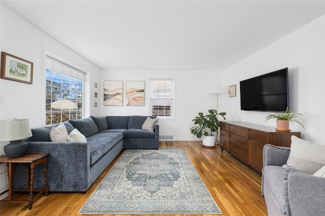 living area with visible vents and light wood-type flooring