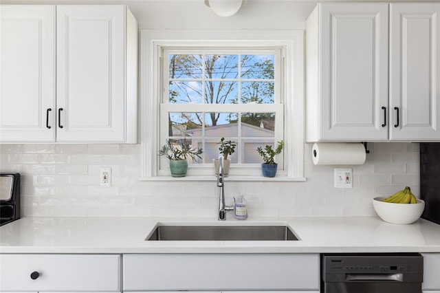 kitchen featuring a sink, light countertops, white cabinets, and dishwasher