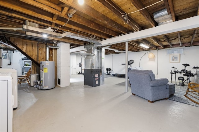 unfinished basement with washer / dryer, heating unit, and water heater
