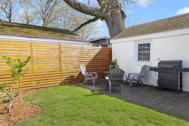 view of yard featuring a patio and fence