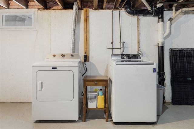 laundry area with separate washer and dryer and laundry area