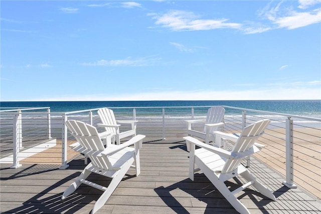 wooden deck featuring a water view