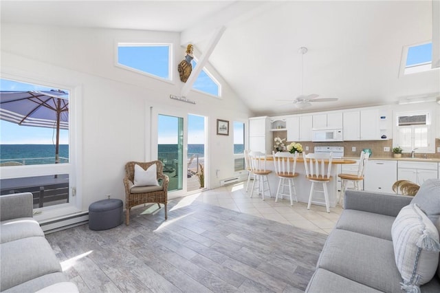 living area with a ceiling fan, beamed ceiling, high vaulted ceiling, a baseboard radiator, and light wood-style flooring