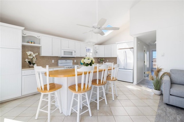 kitchen with light tile patterned floors, open shelves, a ceiling fan, and white appliances