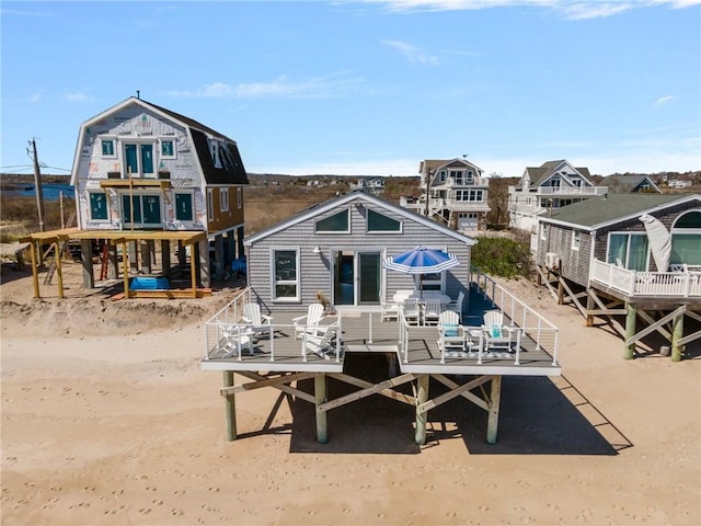 back of property with outdoor dining space