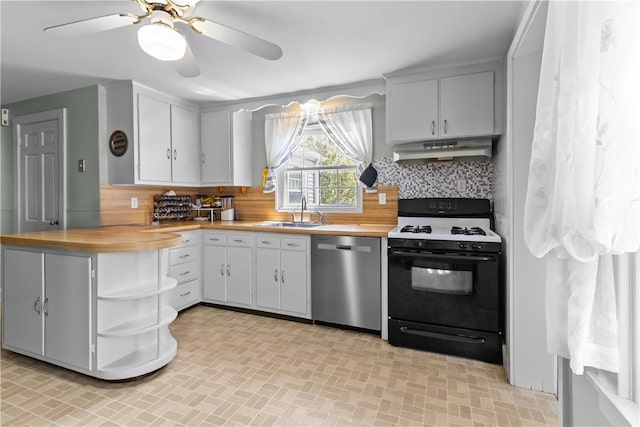 15 Broadmoor Rd, Cranston, RI 02910 - kitchen with stainless steel dishwasher, open shelves, under cabinet range hood, a sink, and gas stove