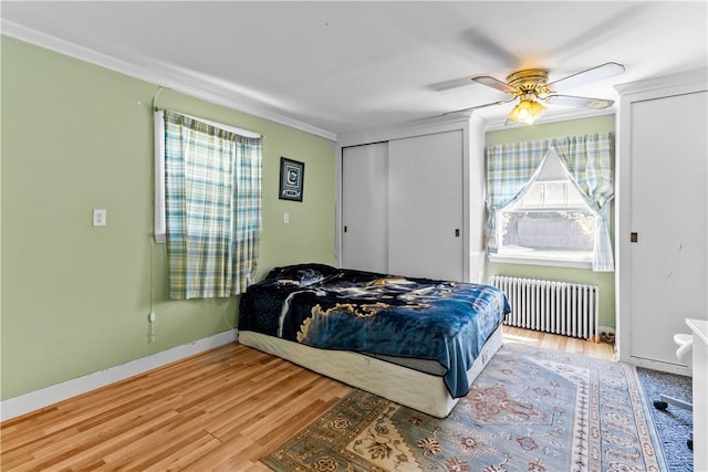 15 Broadmoor Rd, Cranston, RI 02910 - bedroom featuring light wood-style floors, a ceiling fan, crown molding, baseboards, and radiator heating unit