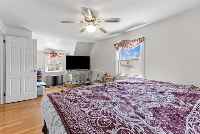 15 Broadmoor Rd, Cranston, RI 02910 - bedroom with light wood-style floors, a ceiling fan, and radiator heating unit