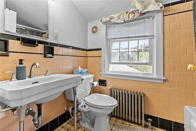 15 Broadmoor Rd, Cranston, RI 02910 - bathroom featuring toilet, tile patterned floors, tile walls, and radiator