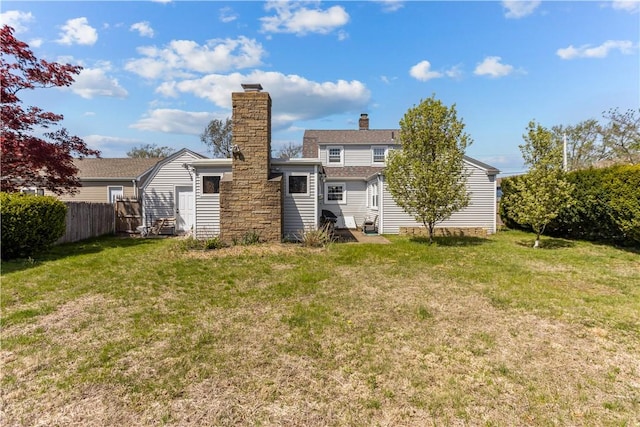 15 Broadmoor Rd, Cranston, RI 02910 - back of property featuring fence, a yard, and a chimney