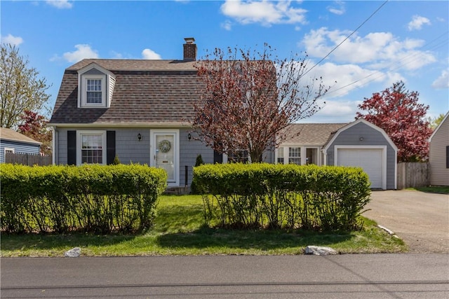 15 Broadmoor Rd, Cranston, RI 02910 - colonial inspired home featuring roof with shingles, a gambrel roof, a chimney, an outdoor structure, and driveway