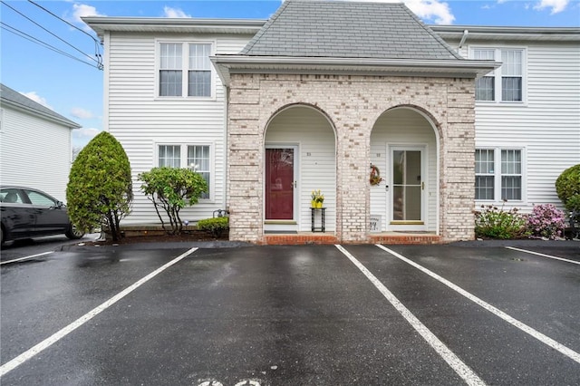 60 Hawthorne Pl Unit 23, North Providence, RI 02904 - exterior space with uncovered parking and brick siding