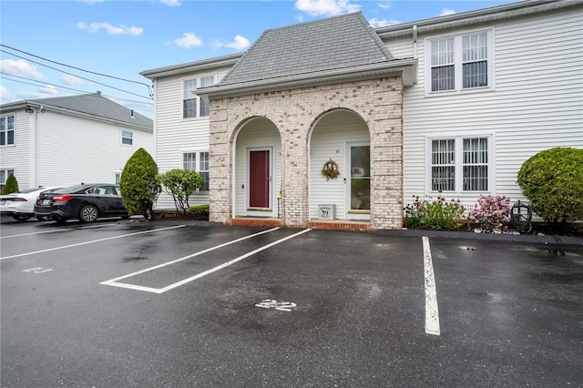 60 Hawthorne Pl Unit 23, North Providence, RI 02904 - view of front of home with uncovered parking and brick siding