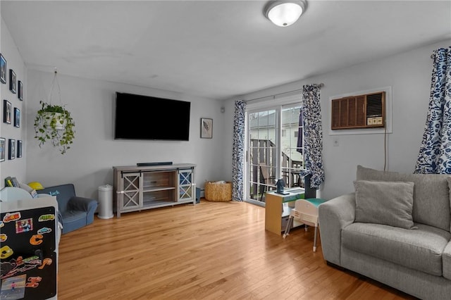 60 Hawthorne Pl Unit 23, North Providence, RI 02904 - living area with a wall mounted AC and wood finished floors