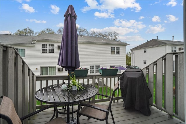 60 Hawthorne Pl Unit 23, North Providence, RI 02904 - wooden terrace with outdoor dining area
