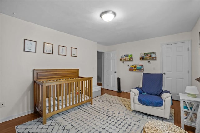 60 Hawthorne Pl Unit 23, North Providence, RI 02904 - bedroom featuring baseboards and wood finished floors