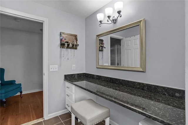 60 Hawthorne Pl Unit 23, North Providence, RI 02904 - bathroom featuring baseboards, tile patterned flooring, vanity, and a notable chandelier