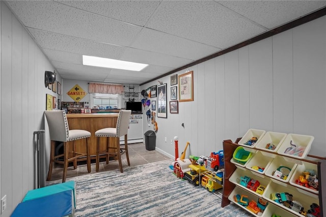 60 Hawthorne Pl Unit 23, North Providence, RI 02904 - recreation room featuring a dry bar, tile patterned flooring, and a baseboard heating unit