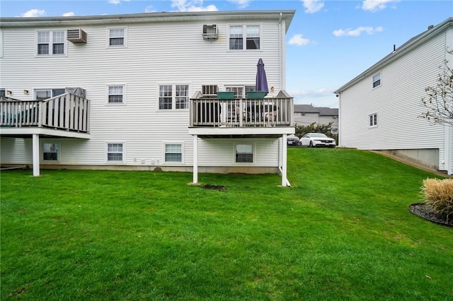 60 Hawthorne Pl Unit 23, North Providence, RI 02904 - back of property featuring an AC wall unit, a wooden deck, a wall unit AC, and a yard