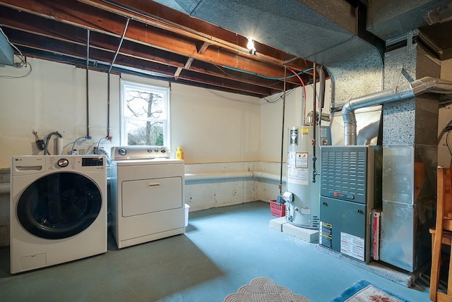 180 Birkshire Dr, Warwick, RI 02886 - clothes washing area with water heater, heating unit, laundry area, and independent washer and dryer