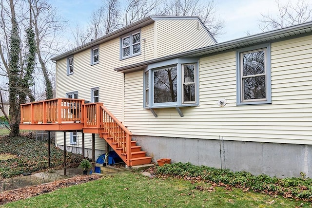 180 Birkshire Dr, Warwick, RI 02886 - rear view of property featuring a wooden deck, stairs, and a yard
