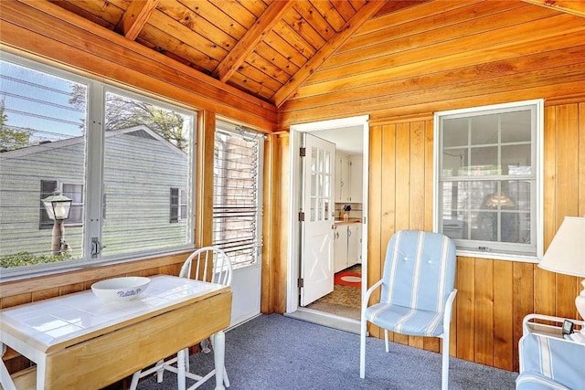 sunroom / solarium with beamed ceiling