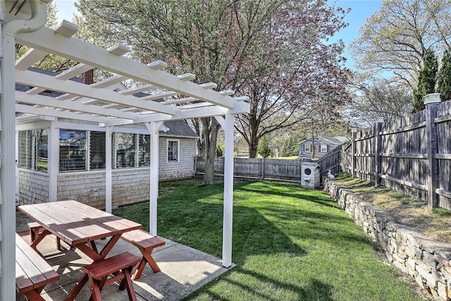 view of yard featuring outdoor dining area, a fenced backyard, a pergola, and a patio