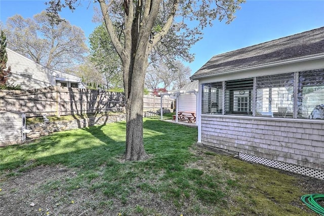 view of yard with fence and a patio