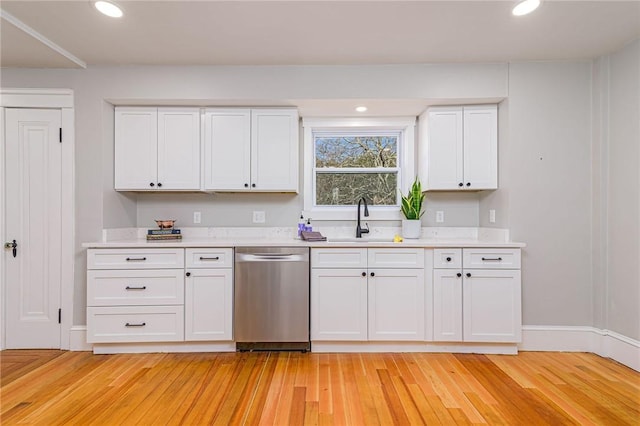 888 Providence St, West Warwick, RI 02893 - kitchen featuring a sink, light countertops, white cabinets, and dishwasher