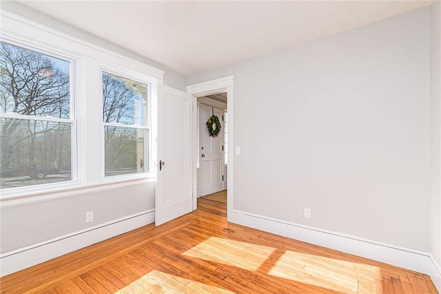 888 Providence St, West Warwick, RI 02893 - empty room with baseboards and wood finished floors