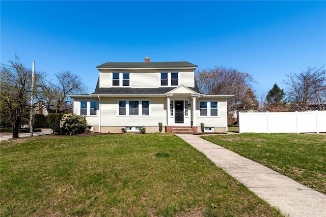888 Providence St, West Warwick, RI 02893 - view of front facade with a front lawn, fence, and a chimney