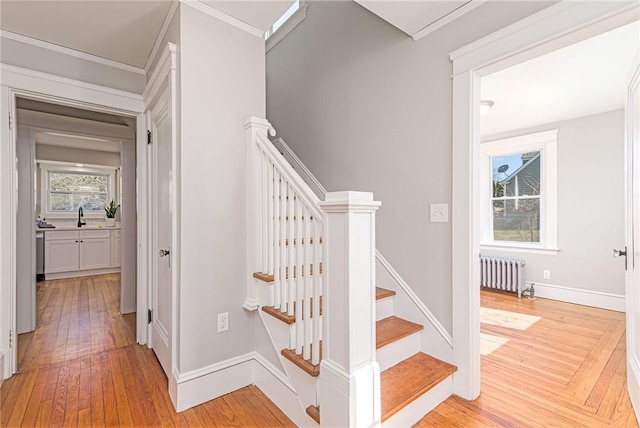 888 Providence St, West Warwick, RI 02893 - stairway featuring radiator, ornamental molding, baseboards, and hardwood / wood-style floors
