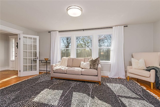 888 Providence St, West Warwick, RI 02893 - living room with baseboards and wood finished floors