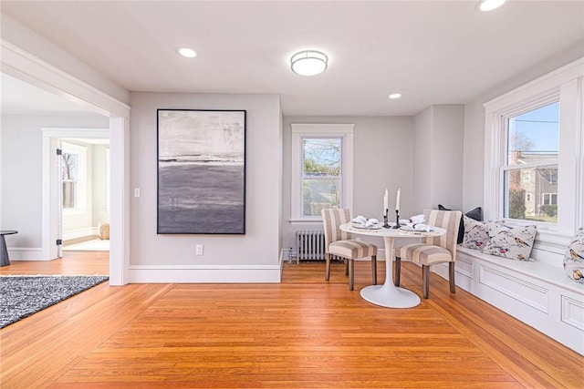 888 Providence St, West Warwick, RI 02893 - dining area with a healthy amount of sunlight, radiator, recessed lighting, and light wood finished floors