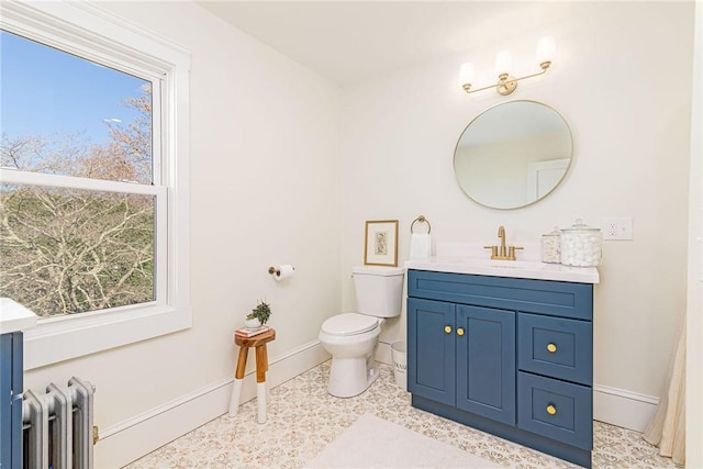 888 Providence St, West Warwick, RI 02893 - bathroom with baseboards, vanity, and toilet