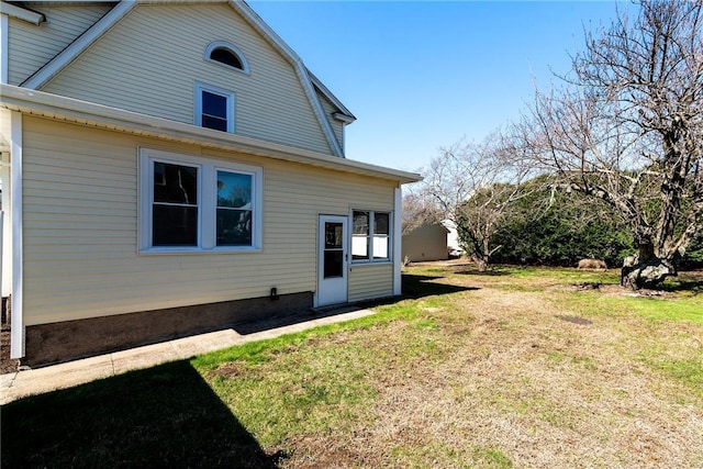 888 Providence St, West Warwick, RI 02893 - rear view of property with a lawn and a gambrel roof