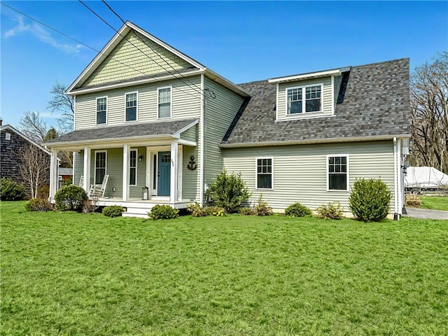 257 Ives Rd, Warwick, RI 02818 - traditional-style house featuring a porch, a shingled roof, and a front yard