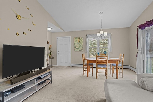dining area featuring carpet floors, a baseboard heating unit, lofted ceiling, and a chandelier