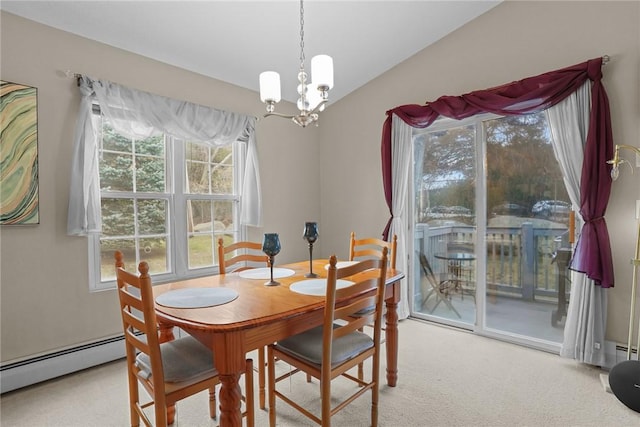 carpeted dining area featuring baseboard heating and a notable chandelier