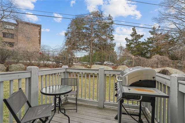 wooden terrace featuring grilling area