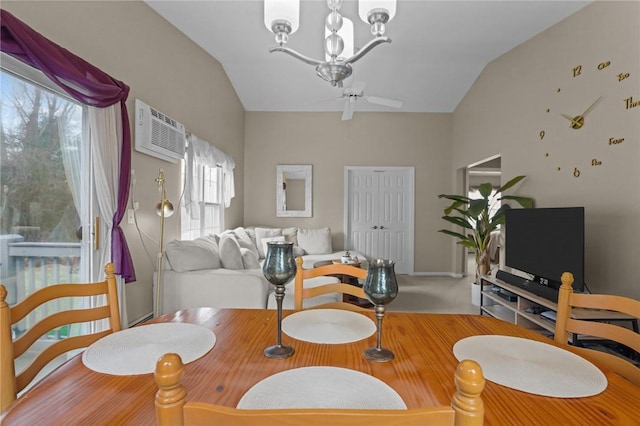 dining area featuring an inviting chandelier, carpet floors, an AC wall unit, and lofted ceiling