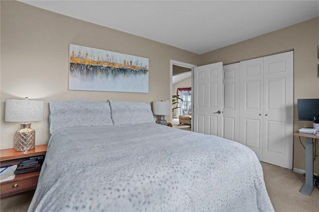 bedroom with a closet and carpet