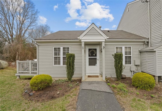view of front of property featuring roof with shingles