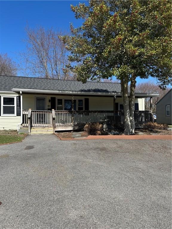 87 Elmbrook Dr, Warwick, RI 02889 - single story home with roof with shingles and covered porch