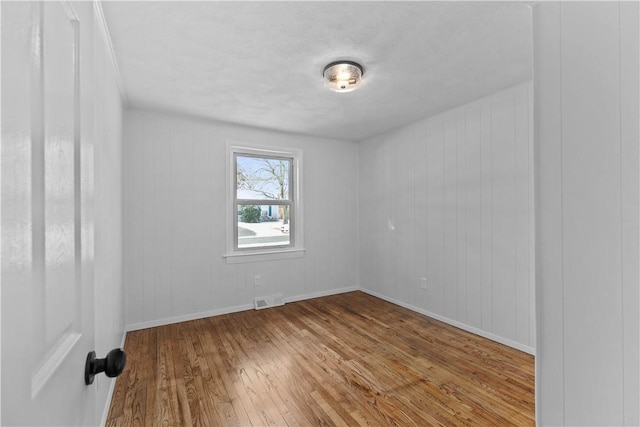 87 Elmbrook Dr, Warwick, RI 02889 - unfurnished room featuring baseboards, wood-type flooring, and visible vents
