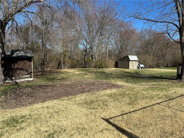 87 Elmbrook Dr, Warwick, RI 02889 - view of yard with a storage unit and an outbuilding