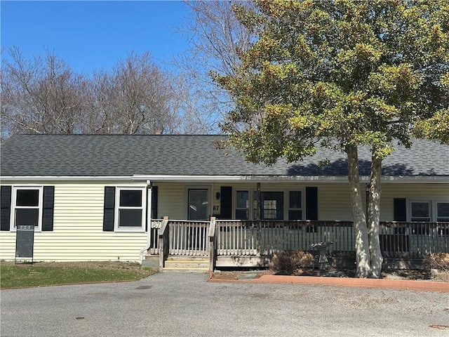 87 Elmbrook Dr, Warwick, RI 02889 - view of front facade with covered porch and a shingled roof
